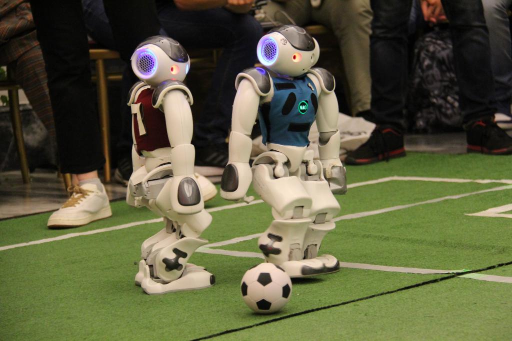 Robots playing football top